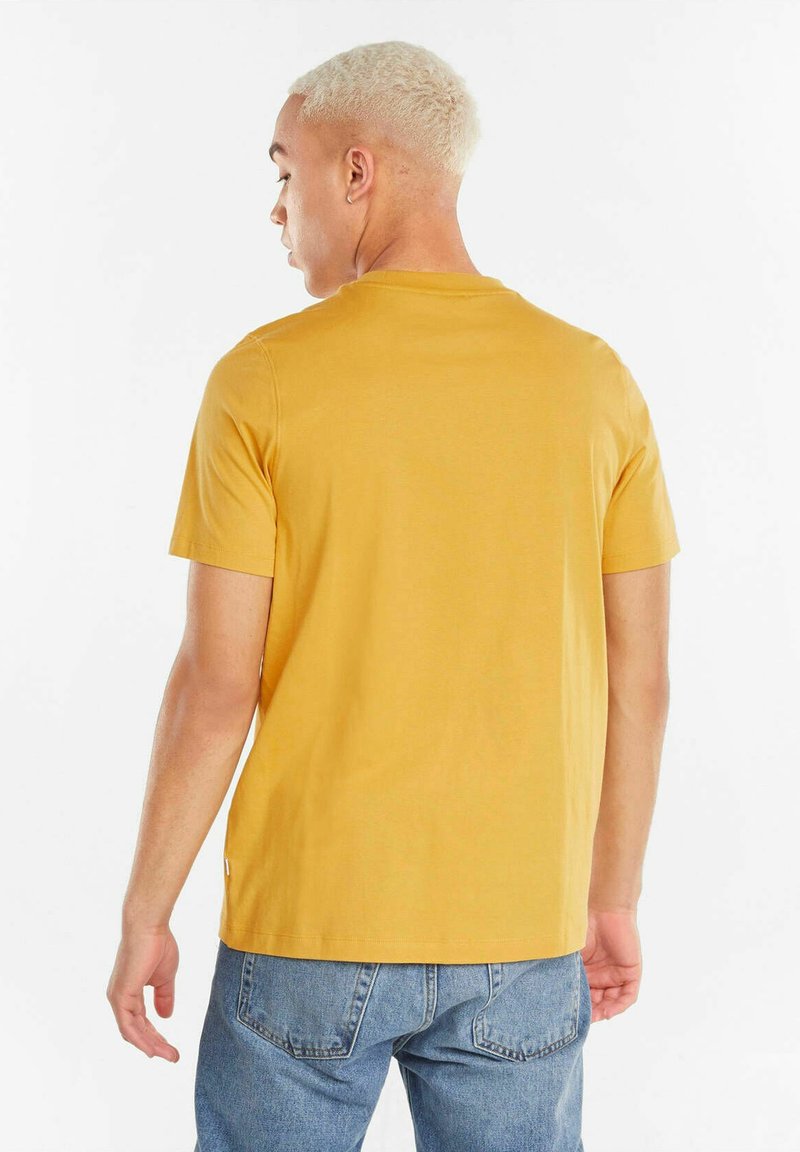 Puma MODERN - T-Shirt Basic - Gelb