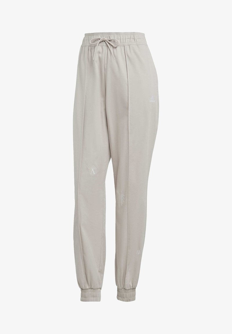 Adidas Sportswear WITH HEALING CRYSTALS INSPIRED GRAPHICS - Jogginghose - Taupe/white