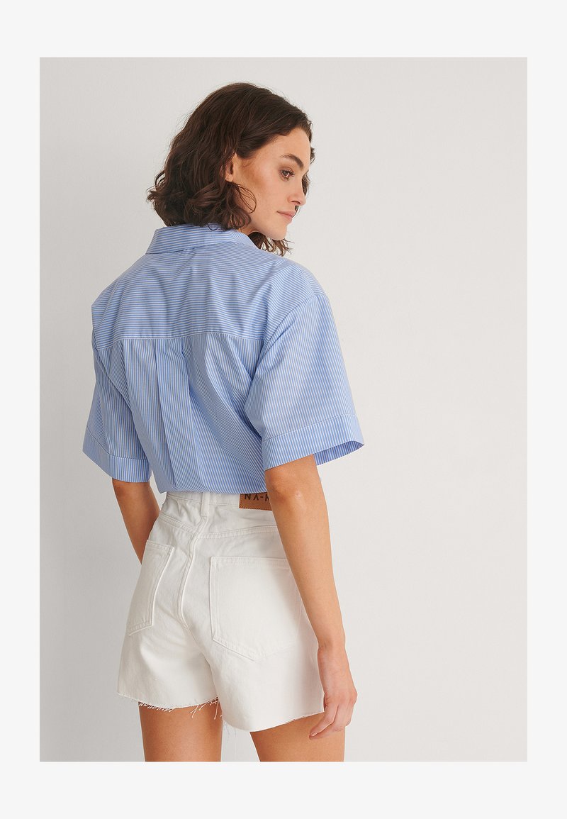 NA-KD RAW HEM BUTTONED - Jeans Shorts - White