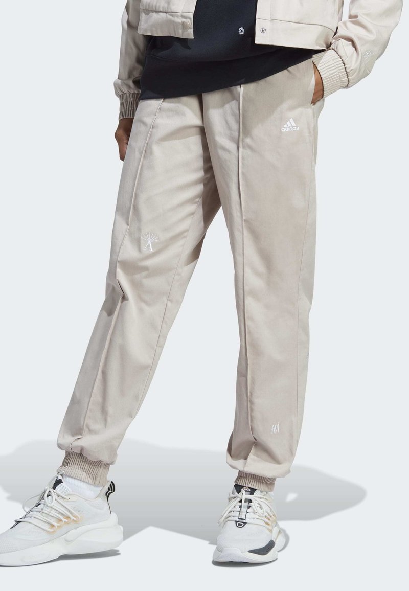 Adidas Sportswear WITH HEALING CRYSTALS INSPIRED GRAPHICS - Jogginghose - Taupe/white
