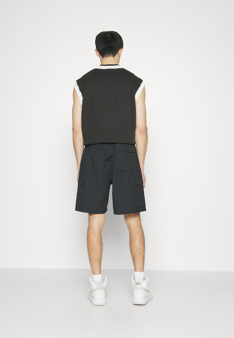 Nike Sportswear CLUB - Jogginghose - Black/white